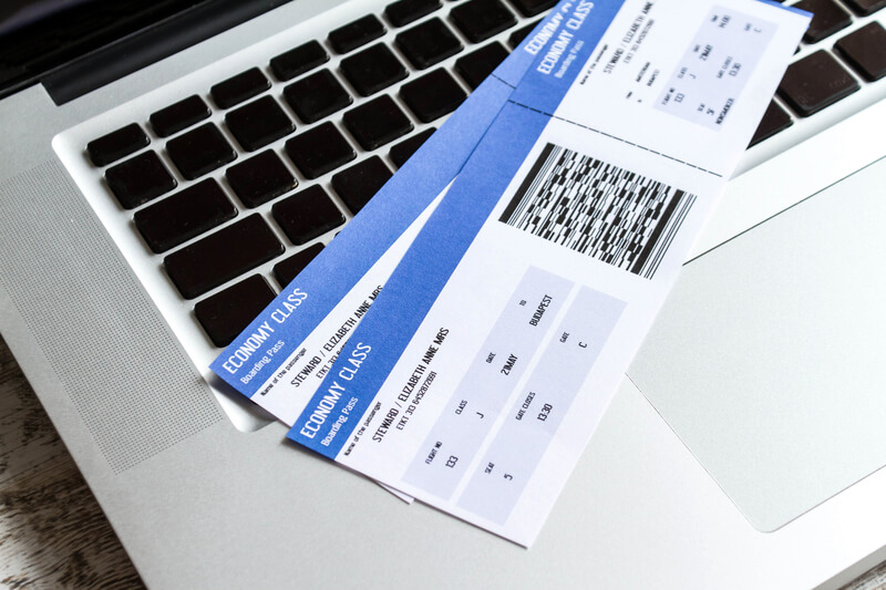 Plane tickets on a laptop