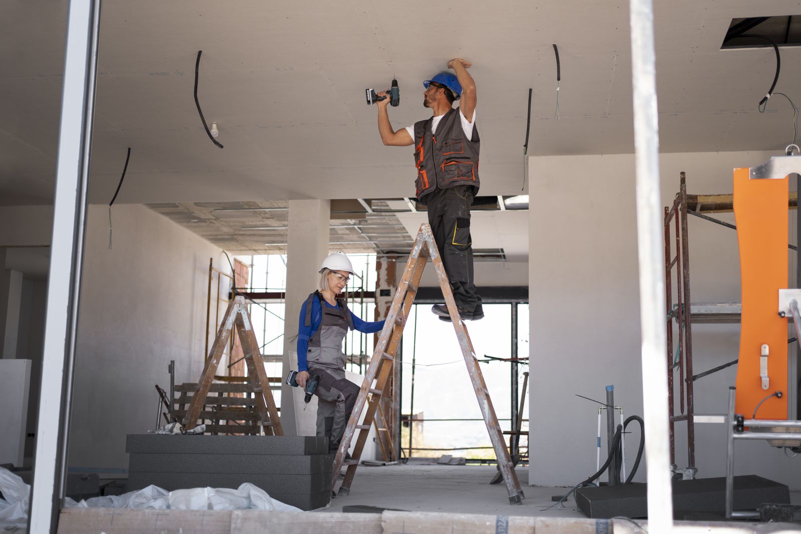 couple preparing their home for a ceiling hoist