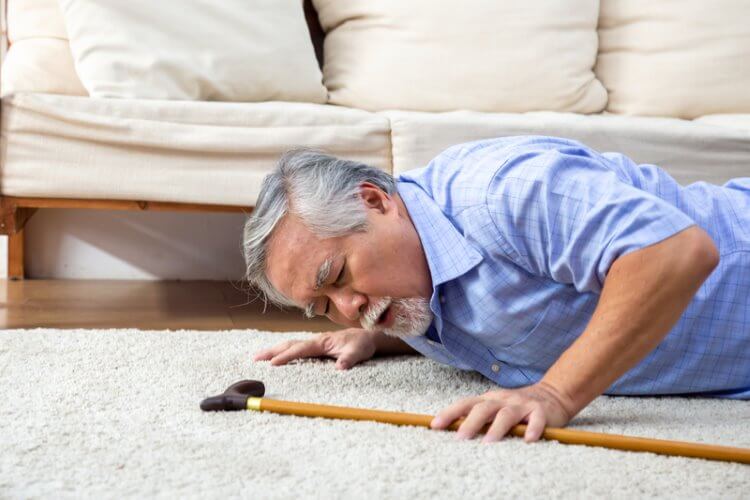 Older man who has fallen over