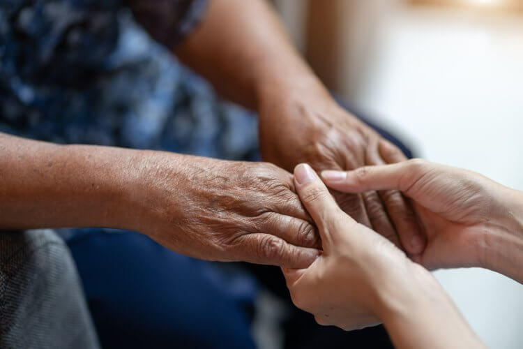 Helping up an older person